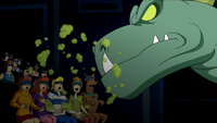 Dinosaur Spirit breathes on audience.png