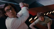 Gideon looks up as Knives prepares to strike him.