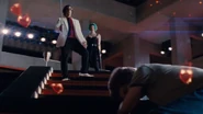 Gideon pushes Scott down.