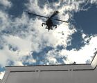 One of the several AH-64 Apaches guarding the gate perimeter.