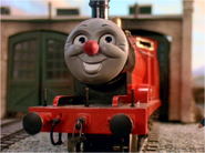 James laughs after the Vicar calls him "James the Red Nosed Engine" in Buzz Buzz