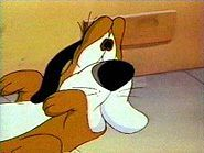 Byron Basset (voiced by Frank Welker)