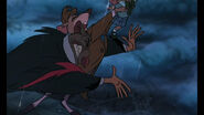 Ratigan knocks poor Basil through the edge