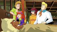 Daphne helps scooby to be sick in bed in Scooby Doo Mystery Incorporated into Mystery Solvers Club State Finals