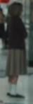 Girl with the light brown skirt