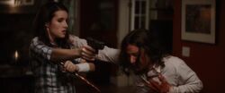 Jill betrays Charlie, stabbing him through the heart.