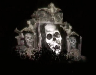 The Phantom joins the Singing Busts' singing, appearing in the catacombs.