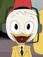 Huey in a yellow sports commentator suit in "The Missing Links of Moorshire!" and "The Richest Duck in the World!"