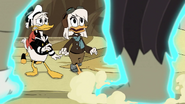 Della, Donald, and Scrooge watching Jeeves grow up so fast after Rockerduck pours some of the Fountain's waters on him