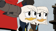 Della and Donald held at gunpoint by Black Heron