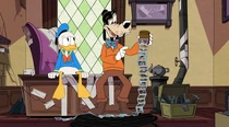 Goofy showing Donald his family photos