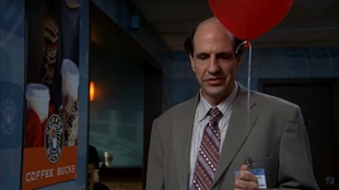 Ted holds a balloon