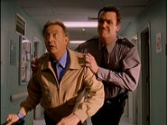As a security guard, Janitor tackles Dr. Kelso. ("My Choosiest Choice of All")