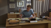 8x8 Cox in his office