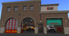 WSA Fire Station after remodeling. Distinctive "Ketchup and Mustard" HCI Trucks and PMR Ambulance visible.