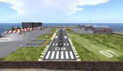 SLWB 09 approach showing working PAPI on the left of runway (August 2014).