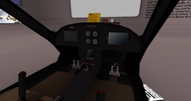 Cockpit with pilot/co-pilot seating and instrumentation.