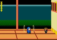 Vs. Hanzo. The gold light is an invincible barrier. Alex must avoid being touched by it.