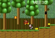 Alex kicks a crazed axe man in the head