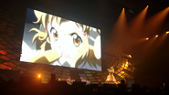 Aoi singing Rainbow Flower during Symphogear Live 2013.