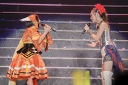 Minako and Aoi Yūki singing Hanasaku Yūki during Symphogear Live 2018.