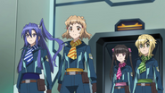 Tsubasa, Hibiki, Shirabe and Kirika in their S.O.N.G. uniform.