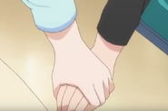 Miyoshi tightening her grasp on Lucy's hand