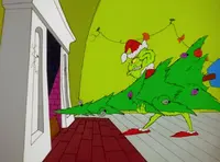 Grinchstole-animationscreencaps.com-1880.webp (59 KB) He then starts to stuff the tree up.