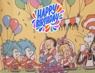 Thing 1 & Thing 2, Sally, Conrad and The Cat in the Hat eating cupcakes and having a party.