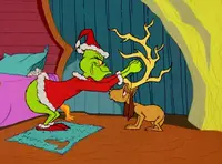 Grinchstole-animationscreencaps.com-1122.webp (84 KB) The Grinch ties antlers on Max's head.