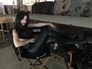 Eme as Izzy 01, in black and heels