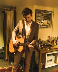 Mendes backstage getting ready to perform for the Queen
