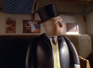 Sir Topham Hatt on board a train.