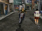 Charlie riding his motorcycle in free quest in What's Shenmue?.