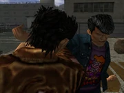 Goro fighting Ryo when he first arrives at the harbor.