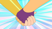 She-Ra and Glimmer hold hands as they work together to defeat the Horde soldiers