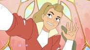 Adora waves to the camera