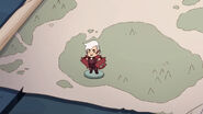 Tiny Scorpia being placed on a map