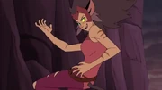Catra leaps into the air, preparing to strike She-Ra