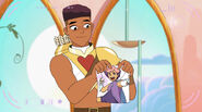 Bow holds up a picture of Glimmer