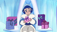 Frosta confusedly examines a present