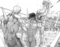 Eren's Titan is shot as the Armored Titan frees itself