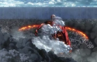 The Colossal Titan sets Shiganshina on fire