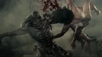 The White Titan destroys two regular Titans at once