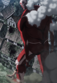 Eren grabs the Colossal Titan's leg