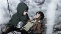 Mikasa retrieves Eren from his Titan