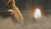 An armored Titan destroys the gate