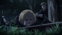 Armin dives to the ground upon being alerted to enemies nearby