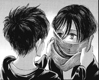 Eren wraps his scarf around Mikasa