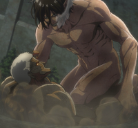 Eren grapples with the Armored Titan